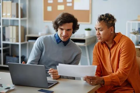Two Colleagues Discussing Project Stock Photos