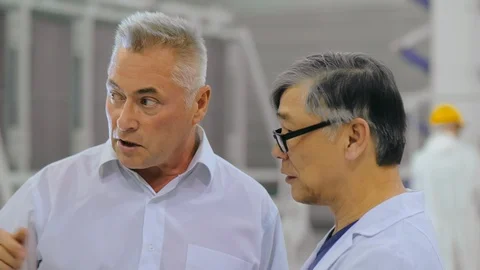 Two colleagues engineers or scientists talk discuss in research laboratory of Stock Footage 120909291