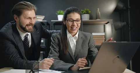 Two colleagues giving high five after finishing common task Stock Footage 125499807