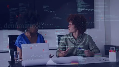 Two colleagues glancing and discussing tech plans while code overlay floating Stock Footage 333105481