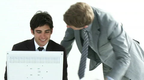 Two colleagues helping each other in an office 動画素材 564290