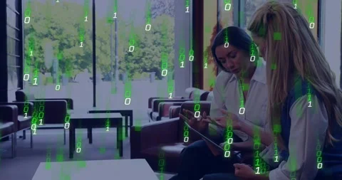 Two colleagues leaning over tablet and tapping, starting green code overlay Stock Footage 331570827