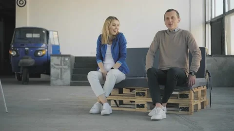 Two colleagues learn dance in the office, ride in the chair of the chief Stock Footage 165386254