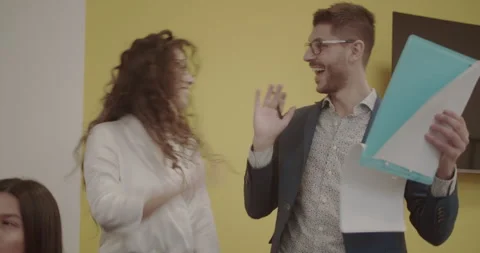 Two colleagues making high five Stock Footage 258372328