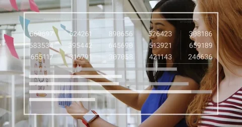 Two colleagues picking printed chart from stack and aligning planning graph on Stock Footage 329782906