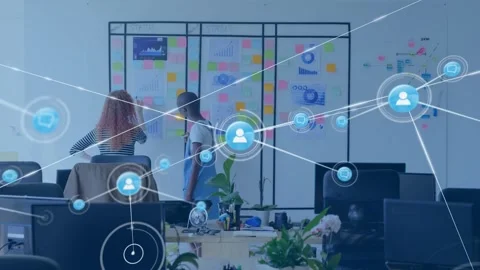 Two colleagues pointing at glass board, causing growing icon net over notes for Stock Footage 332642414