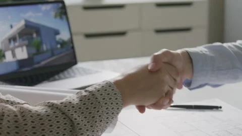 Two Colleagues Shaking Hands and Discussing Architectural Project Stock Footage 314836825