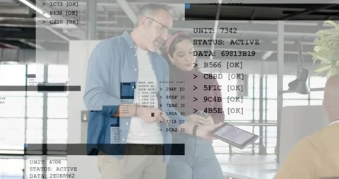 Two colleagues showing tablet, man tapping and initiating tech overlays while Stock Footage 334176090