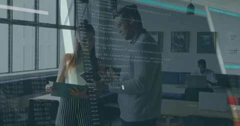 Two colleagues at table reviewing documents on tablet, JavaScript overlay Stock Footage 315544455