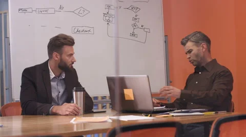 Two colleagues talking about business Stock Footage 68350688