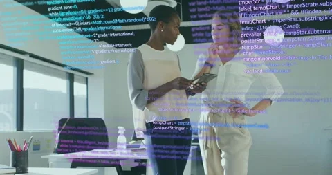 Two colleagues tapping tablet and navigating animated code overlay while Stock Footage 317800205