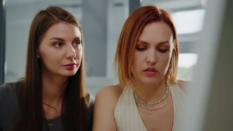 Two colleagues while communicating in the office Stock Footage 232477889