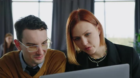 Two colleagues work in open space. Business meeting in the office Stock Footage 232476342