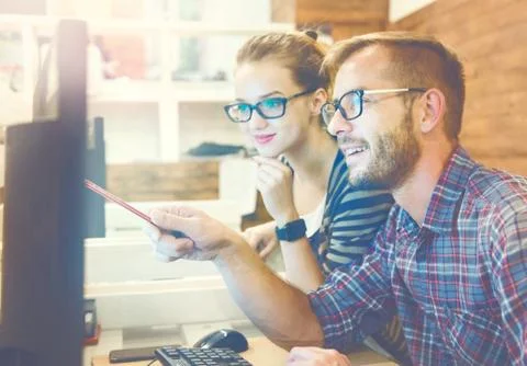 Two colleagues working together in a creative studio Stock Photos