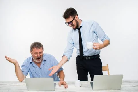 The two colleagues working together at office on white background Stock Photos