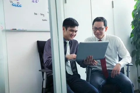 Two Colleagues Working Together Stock Photos