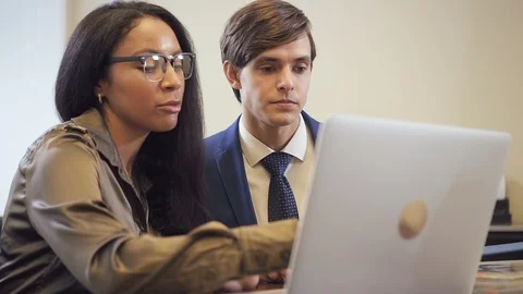 Two colleagues working together on project business strategy in office. Stock Footage 103914148