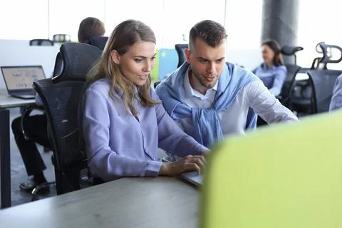 Two collegues discussing documents and other working moments in office. Stock Photos