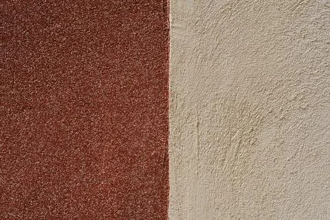 Two color plaster wall texture split vertically into brown and beige in hor.. Stock Photos