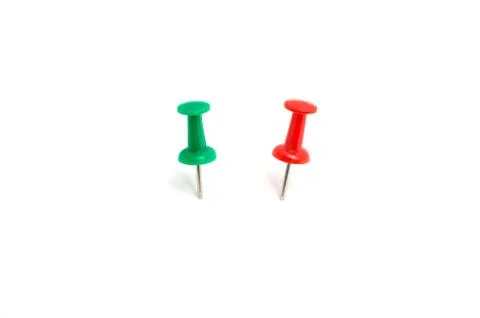 Two color push pin and on isolated white background Stock Photos