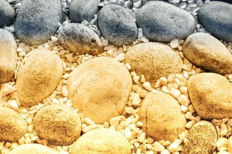 Two-color texture of large and small stones, tinted Stockfoto's