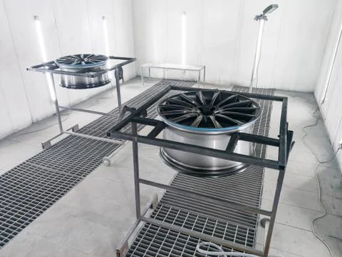 A two colored black and silver painted aluminum alloy wheel is mounted on a s Stock Photos