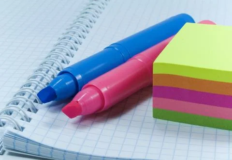 Two colored markers and notes Stock Photos