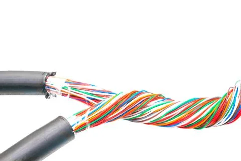 Two colored multi-core telephone cables intertwined. Mains internet connectio 库存照片