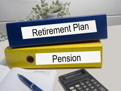 Two colored ring binders with the words Pension, Retirement, in an office Stock Photos