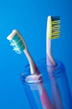 Two colorful toothbrushes Stock Photos