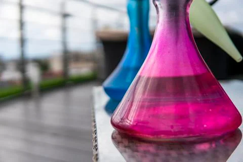 Two colors hookahs on table in hookah lounge in a day. Stock Photos