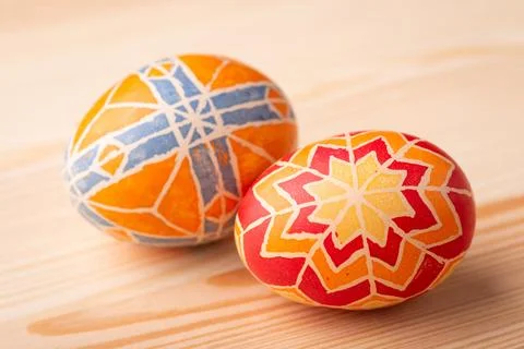 Two coloured Easter eggs on wooden table Stock Photos