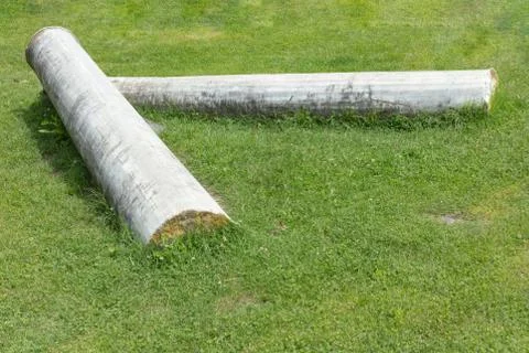 Two column of a historical building lying on the grass Stock Photos