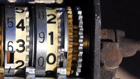 Two Columns Of Numbers On A Mechanical Counter Rotate At High Speed Stock Footage 300748458
