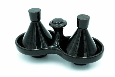 A two compartment black spice rack made by hand Foto stock