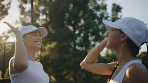 Two competitors greats each other with great tennis match Stock Footage 126305471