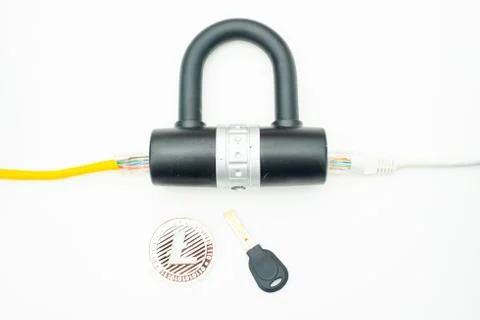 Two computer network cables going through a lock with a key and a crypto Photos