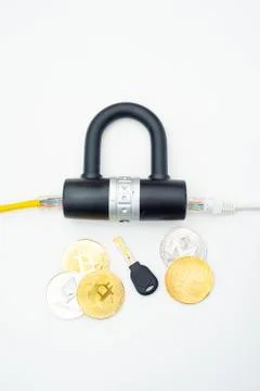 Two computer network cables going through a lock with a key and a crypto Photos
