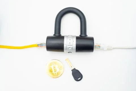 Two computer network cables going through a lock with a key and a crypto Photos