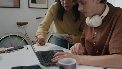 Two Computer Programmers Discussing Software Development in Corporate Office Stock Footage 299239920