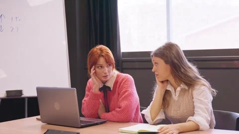 Two concerned women discuss work issues at a corporate meeting. Stock Footage 270765233