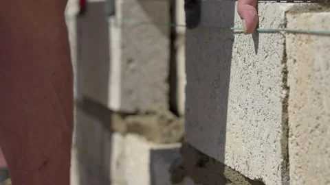 Two Concrete Blocks Places On Wall At The Same Time Stock Footage 239758508