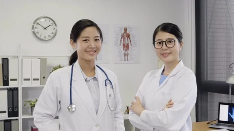 Two confident doctors posing and looking camera Stock-Footage 107298467