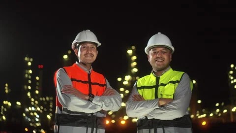 Two confident man engineer with white safety helmet standing front of oil refine Stock-Footage 273459151