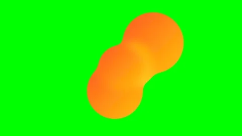 Two connected orange spheres floating against a vibrant chroma key green ba.. Stock Footage 340263335