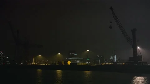 Two construction cranes at night Stock Footage 45320400