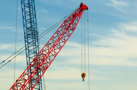 Two construction cranes over blue sky Stock Photos
