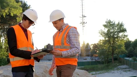Two construction engineer at the construction site Stock Footage 76641035