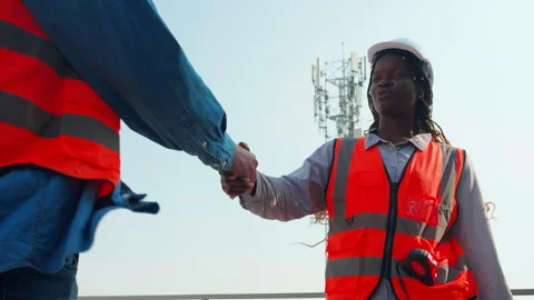 Two construction worker handshake at job site, team engineer or architect h.. Stock Footage 263727073