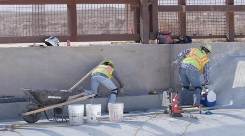 Two Construction Workers Finish Concrete Work Video stock 60383729